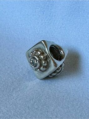 Retired Pandora Dotted Flower Triangle Charm
